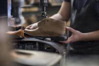 shoemaker-working-on-shoe-in-workshop-westend61